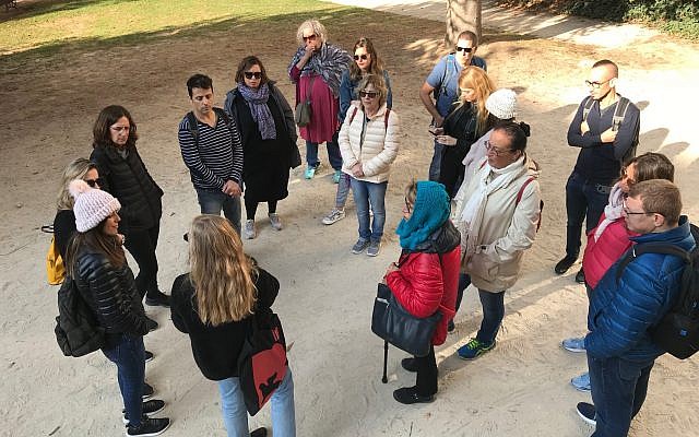 Guide Rotem Gerstel speaks to a tour group in the park. (Robert Sarner/ Times of Israel)