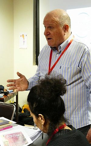 Eitan Drori, resident of Melbourne, founding member of Global Israeli Leadership (GIL) and driving force behind Paris conference, addressing delegates. (Doug Dalgleish)