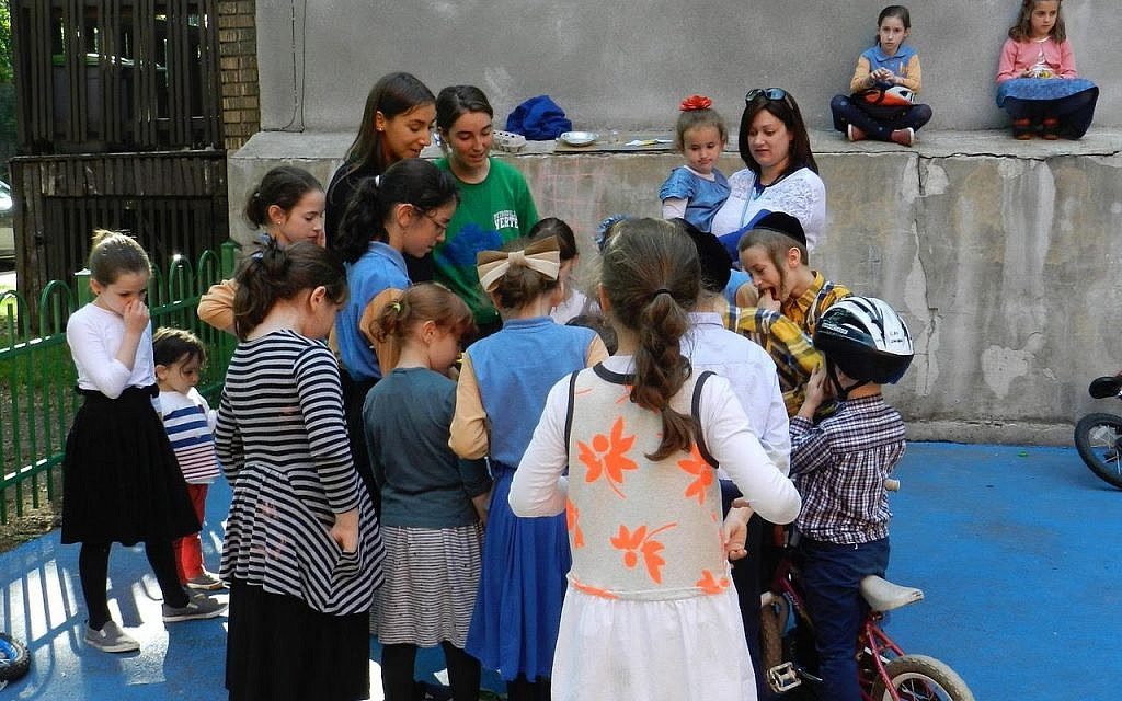 Mindy Pollak outside with a group of children. (Courtesy)