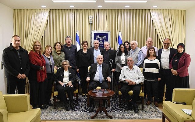 Israeli President Reuven Rivlin receives ERAN delegates at his residence, February 2018. Rivlin’s daughter is a volunteer with ERAN. (Courtesy)