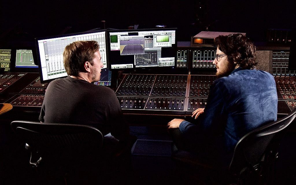 Film director Daniel Roher, right, at a digital post-production studio in Toronto, Ontario, August 29, 2019. (Etye Sarner)