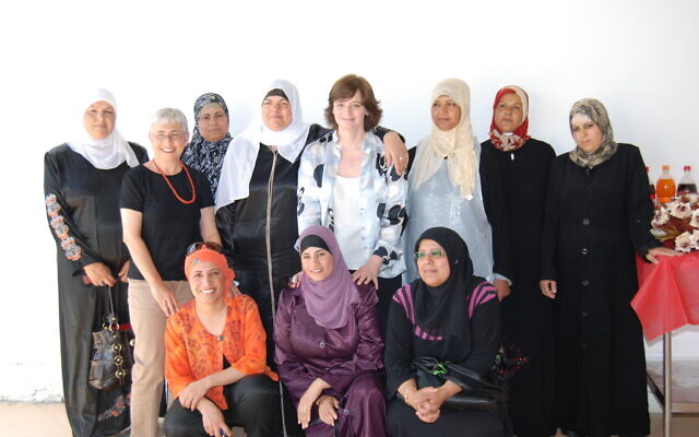 Cherie Blair, wife of former British prime minister Tony Blair, visits the Bedouin village of Hura in 2007. She came to learn about the catering program for single mothers that Amal Elsana-Alh’jooj, pictured front left, helped create.