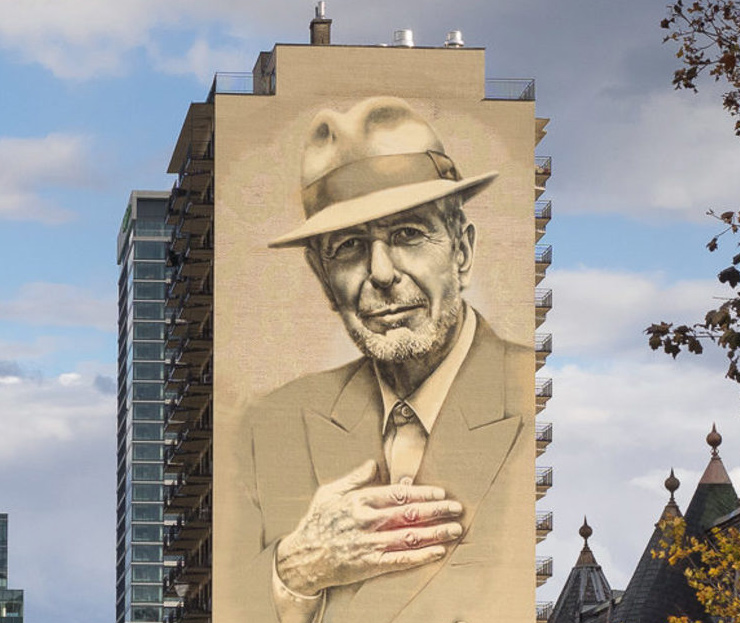 A 22-story tall portrait of Leonard Cohen on the side of a building on Montreal's Crescent Street.
