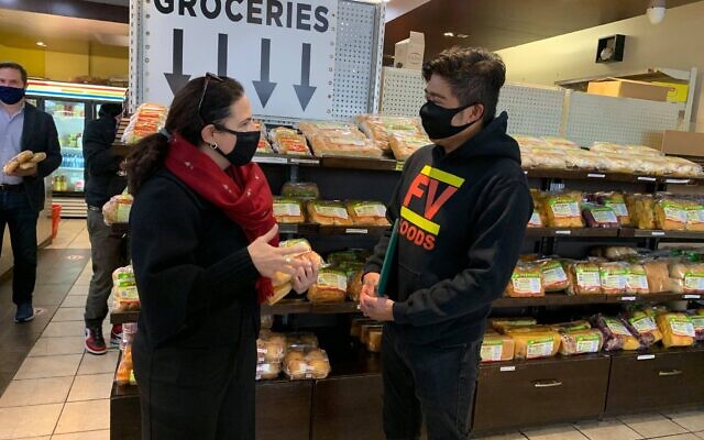 Then-candidate Ya’ara Saks meets a small business owner ahead of the by-election in which she ran to represent the York Centre district in Canada’s Parliament, October 19, 2020.