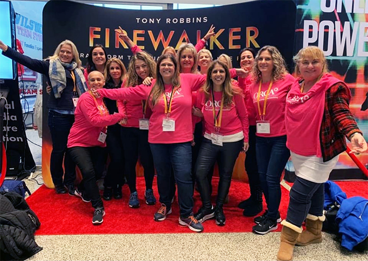 Orly Carmon, center, with an Orca group at an event in New York City with motivational speaker Tony Robbins, November 2018. (Courtesy)