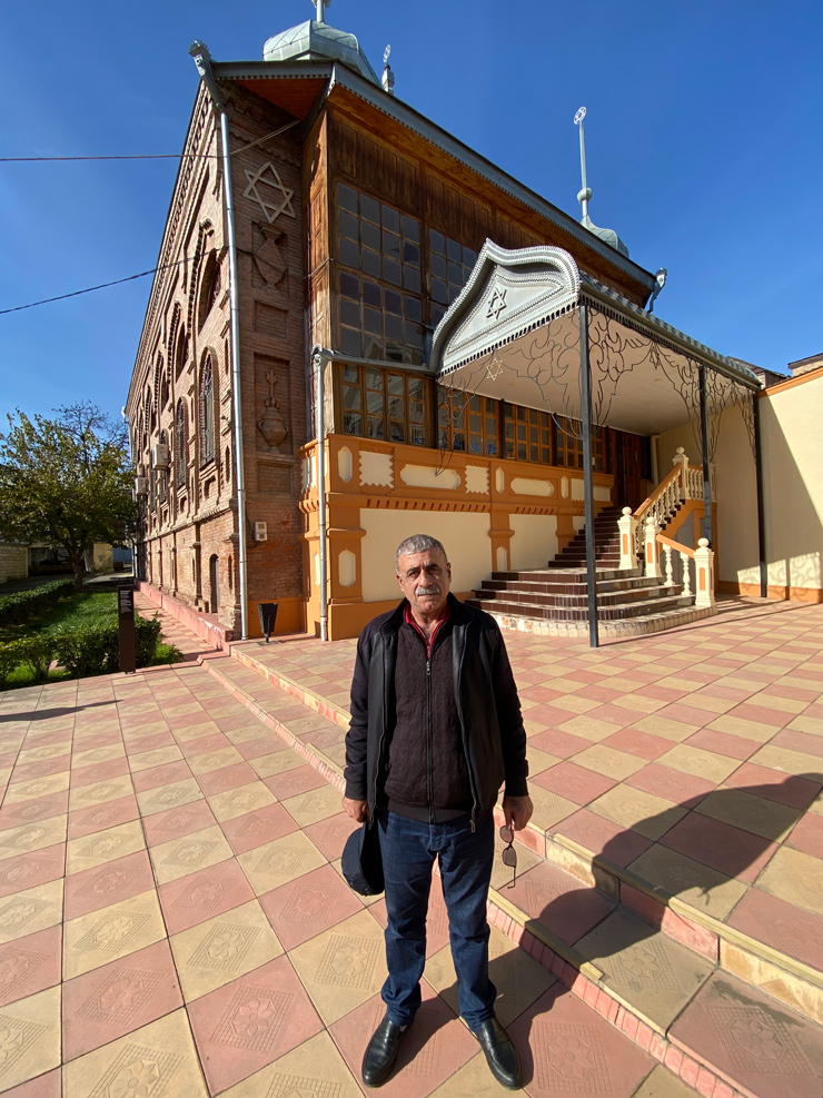 Local resident Anatoliy Manashirov in Red Village outside the Six Dome Synagogue, built in 1888. (Photo by Robert Sarner)
