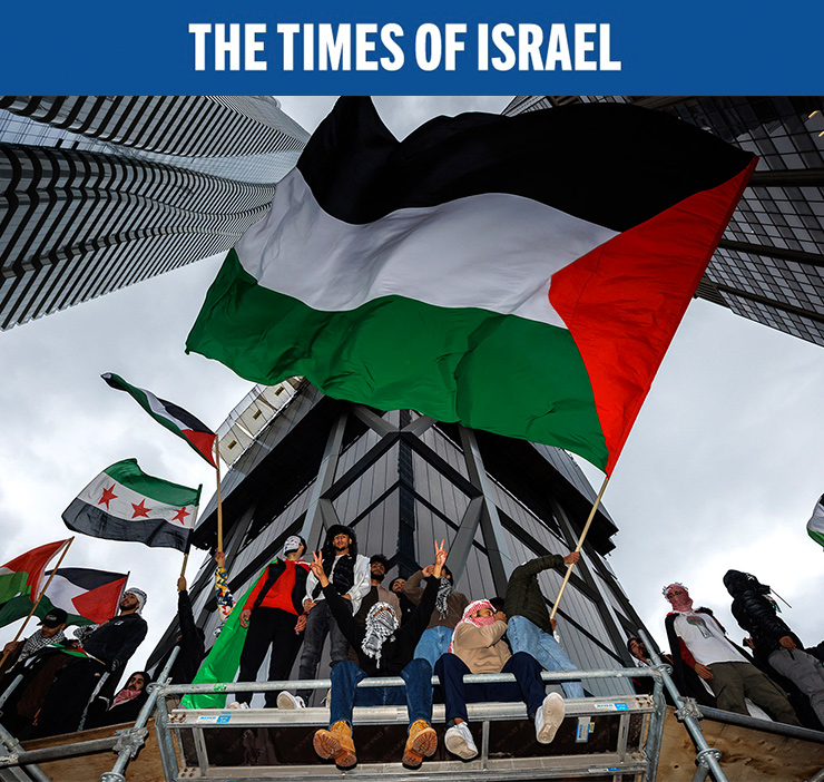 Anti-Israeli demonstrators wave Palestinian flags during a protest in Toronto, Ontario, Canada, October 9, 2023