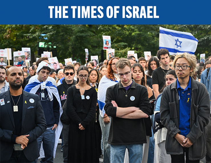 Israel supporters observe a moment of silence as they attend a vigil outside McGill University in Montreal, Canada, on October, 7, 2024, to commemorate the victims of the October 7 massacre by Hamas on Israel. (Graham Hughes / AFP)