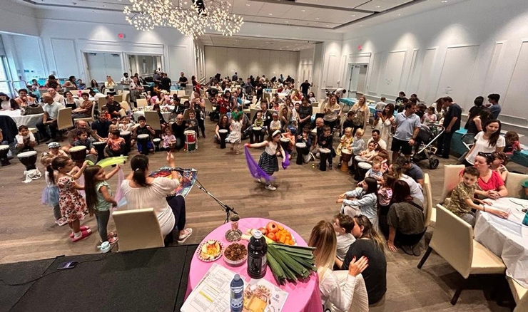 Members of Toronto's large Israeli-Canadian community, including many Israeli newcomers, attend a Hebrew-language Rosh Hashanah event at the Schwartz-Reisman Centre in October 2024.