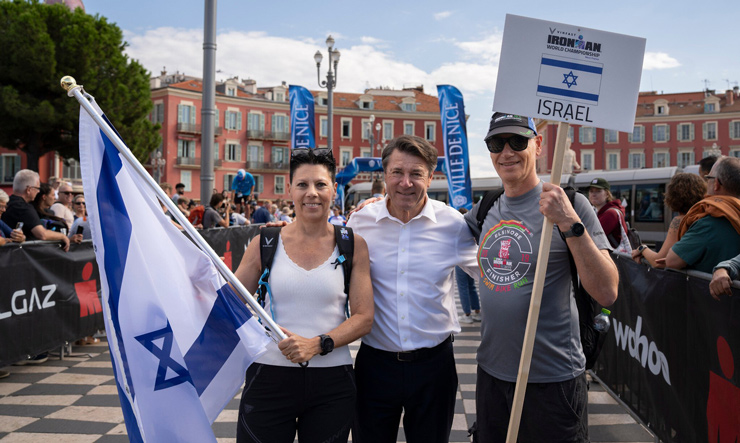 Nice Mayor Christian Estrosi, center, with the Israeli delegation to the Ironman competition at Place Massena in Nice, France, September 19, 2024. (Ghislain Mariette)