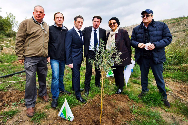Nice Mayor Christian Estrosi, third from right, planting an olive tree in Jerusalem with Nice Deputy Mayor Martine Ouaknine, second from right, on December 27, 2016. (Courtesy)